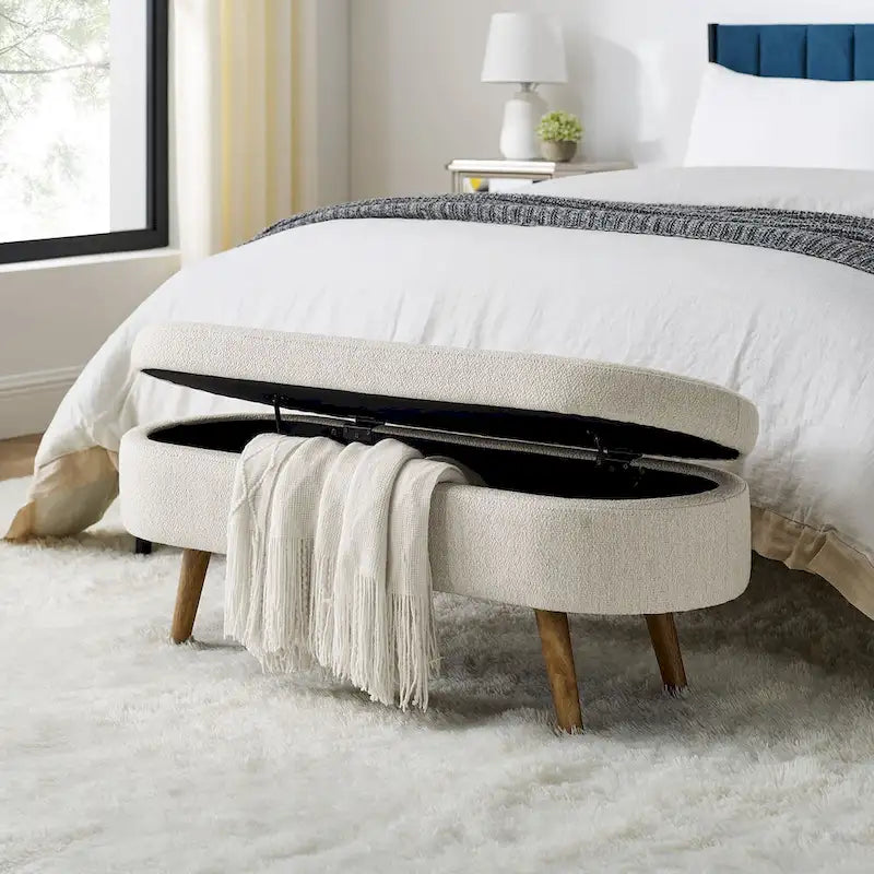 Banc de rangement ottoman ovale beige en lin avec pieds en bois d'hévéa et rangement caché