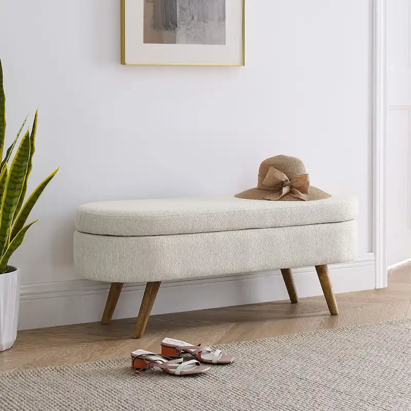 Banc de rangement ottoman ovale beige en lin avec pieds en bois d'hévéa et rangement caché