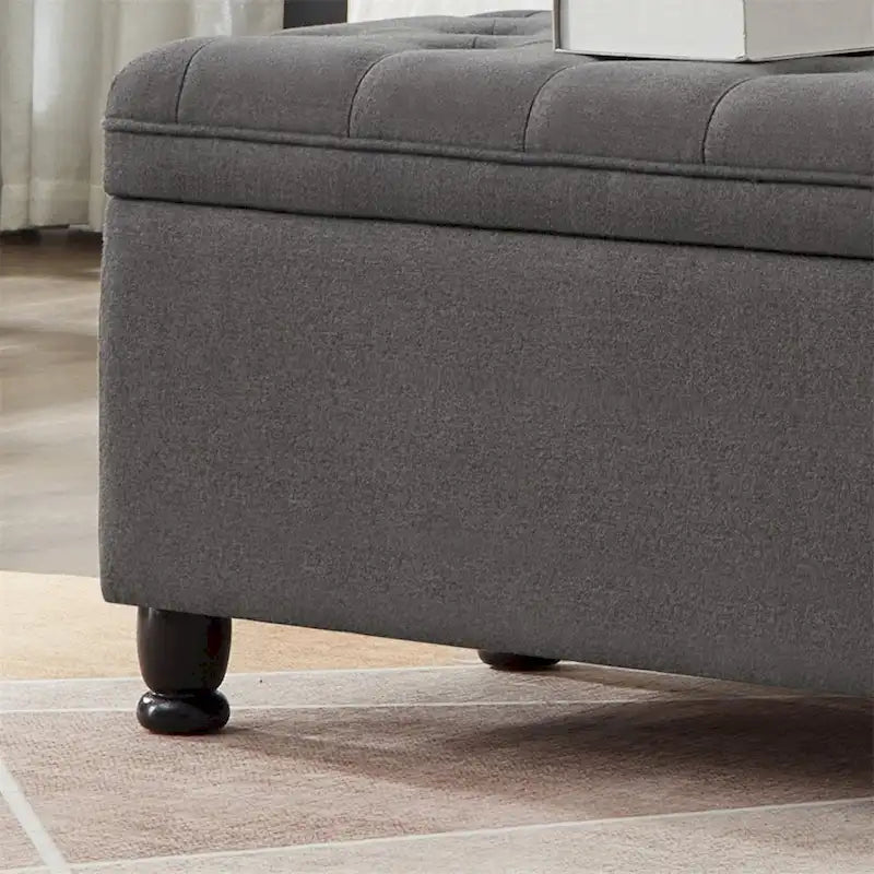 Banc de rangement capitonné avec couvercle à charnière et pieds tournés en bois