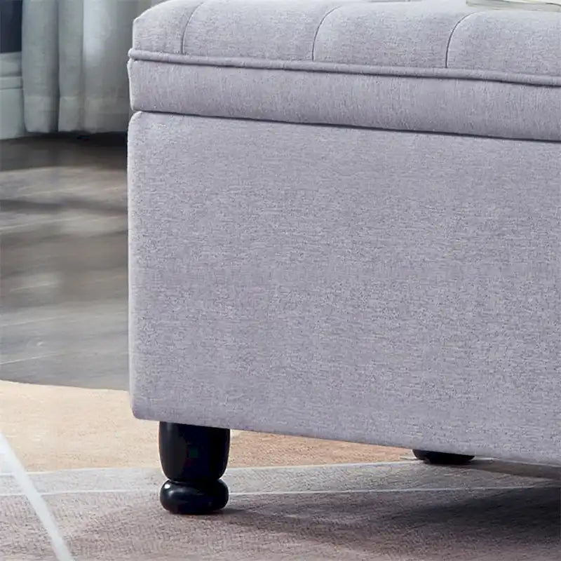 Banc de rangement capitonné avec couvercle à charnière et pieds tournés en bois